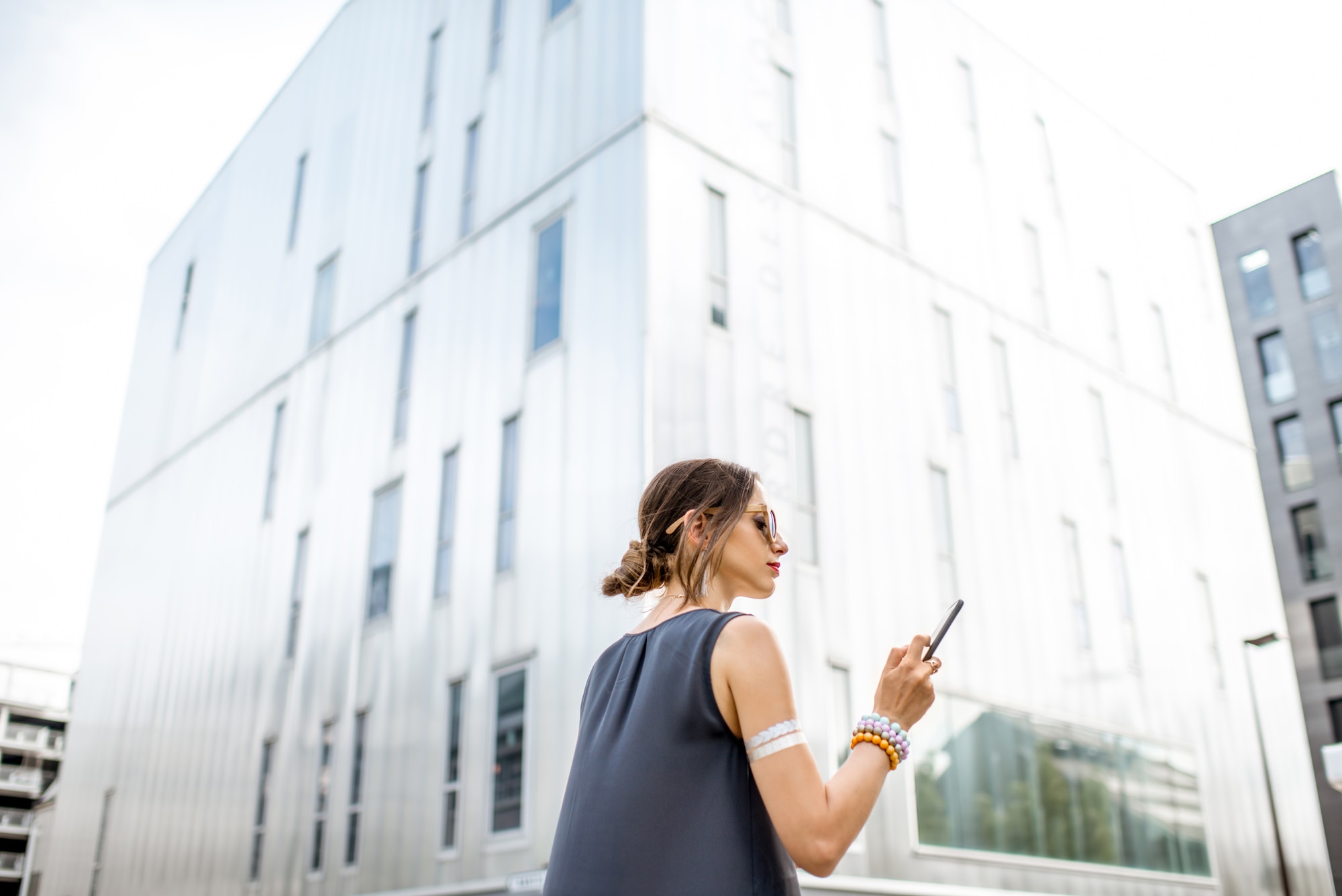 Businesswoman outdoors at the modern office district